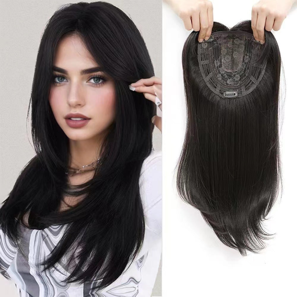 A wig for hair replacement on the top of the head