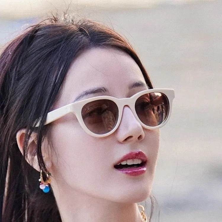 A woman wearing cat-eye sunglasses - Price Value Store
