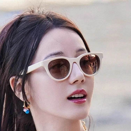 A woman wearing cat-eye sunglasses - Price Value Store