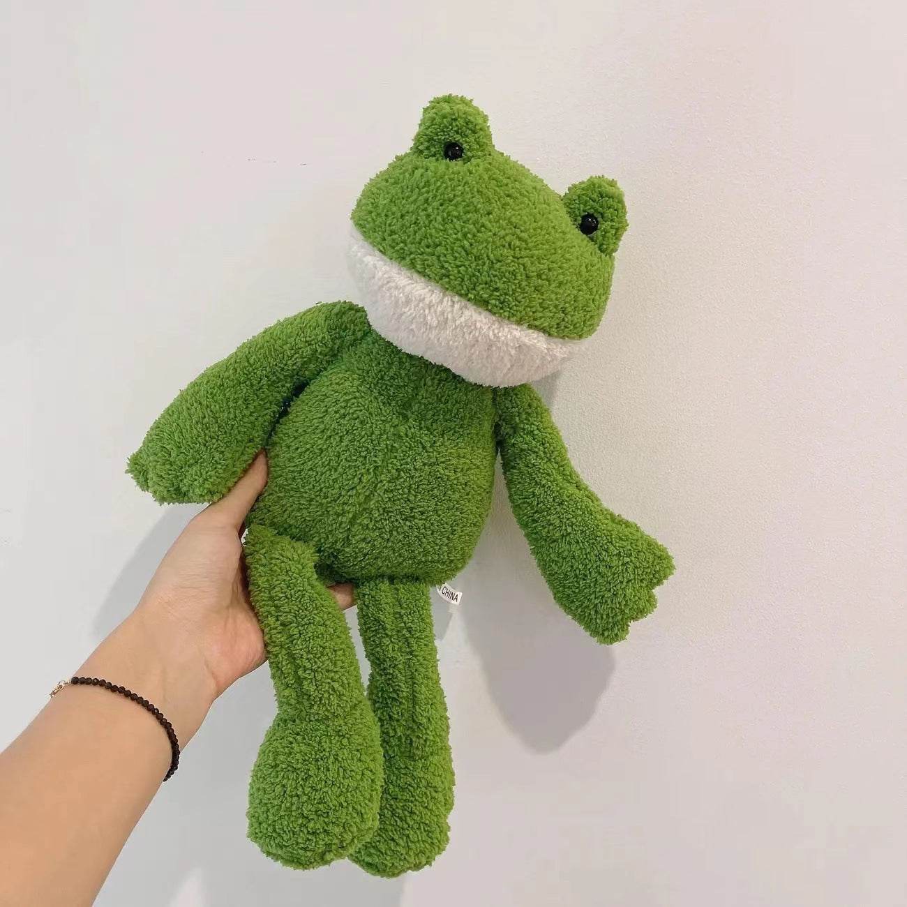 The cute frog soothes the stuffed toy - Price Value Store
