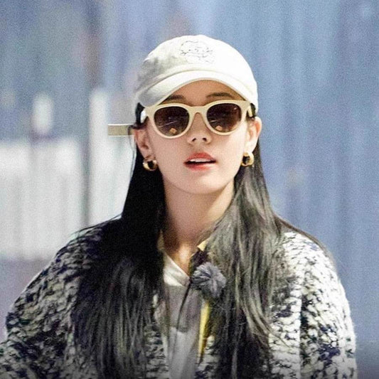 A woman wearing cat-eye sunglasses - Price Value Store